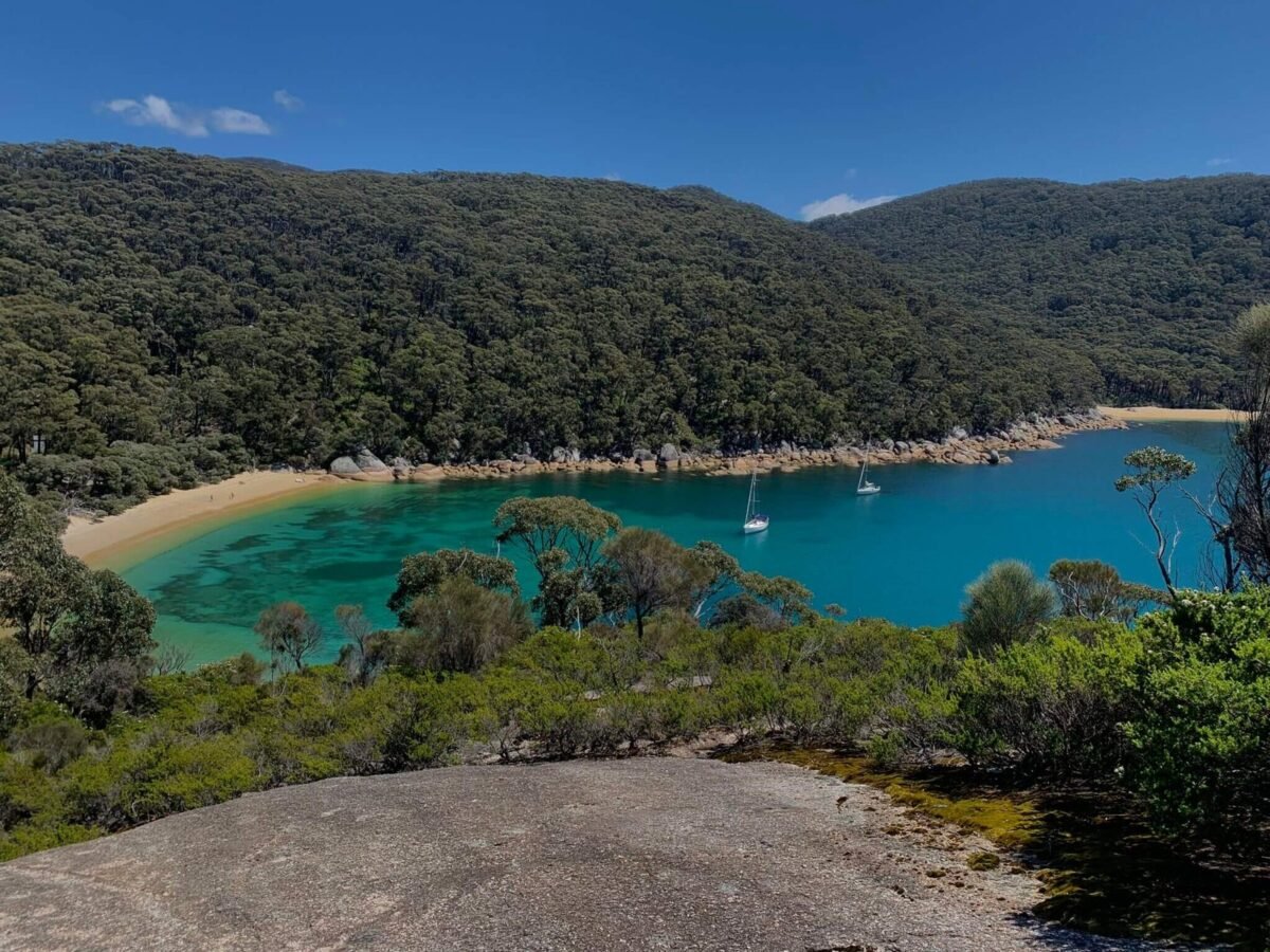 A sheltered turquoise cove fringed by forest at Wilsons Promontory
